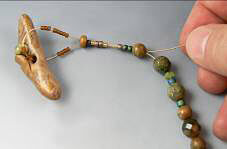 Clay toggle and glass beads on beading wire